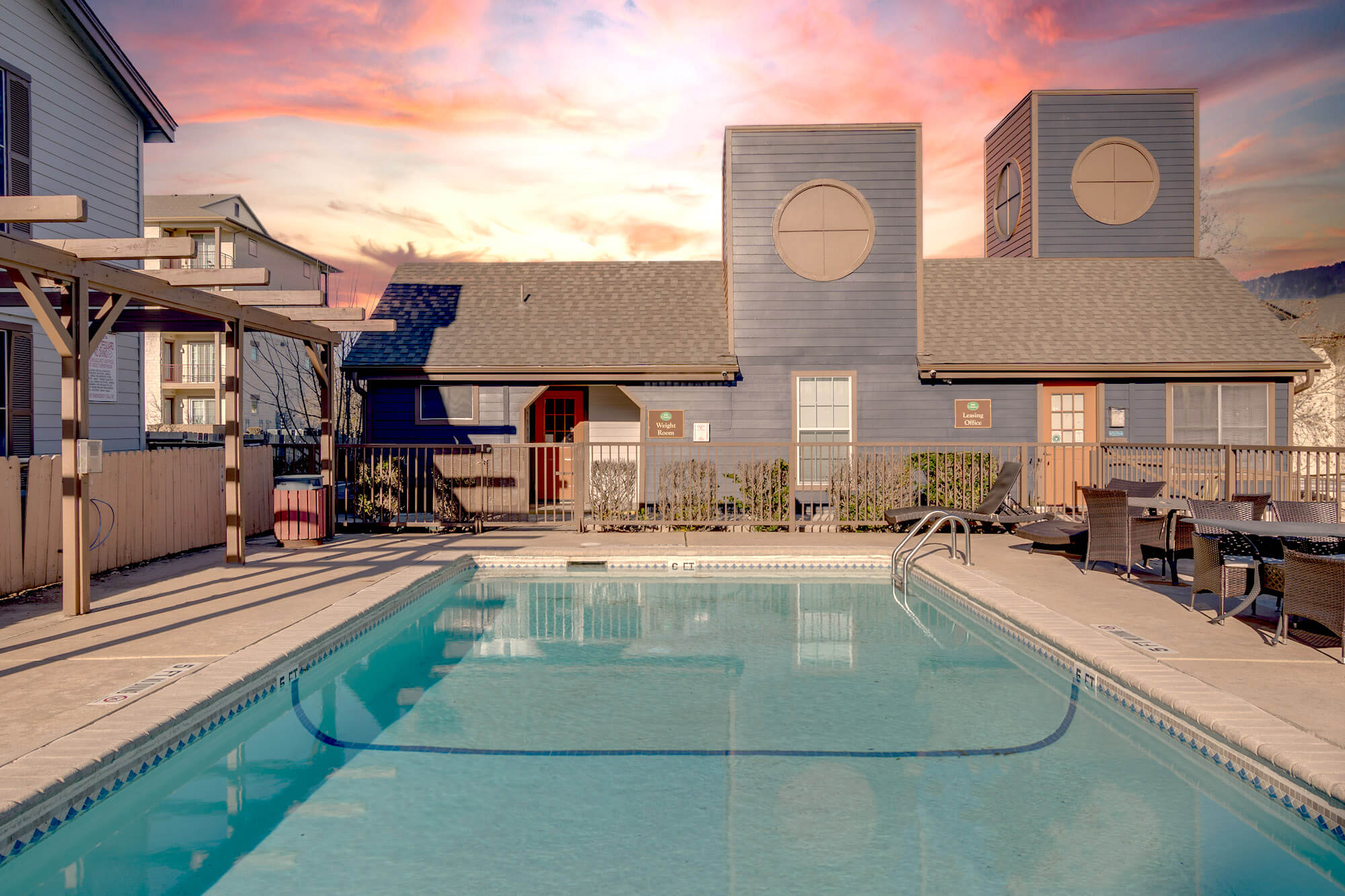 The Hill Country Apartments pool at sunset.